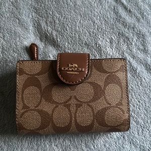 Coach wallet. Signature C’s. Brand new. Never used.